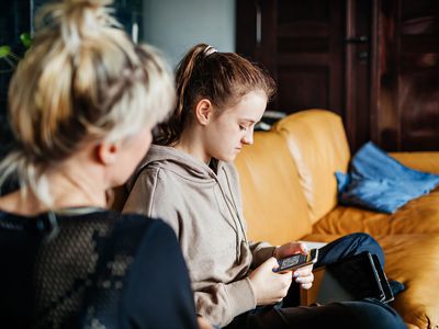 A parent and teen set up Discord parental controls.