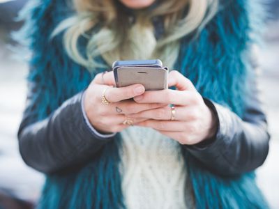 Close up of young woman texting on smartphone, Lake Como, Como, Italy