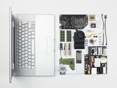 Macbook Pro laptop disassembled with internal components displayed