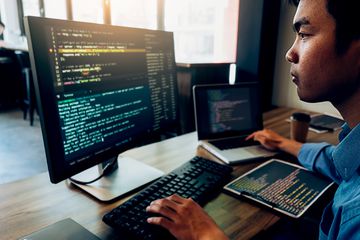 Man using a desktop computer monitor.