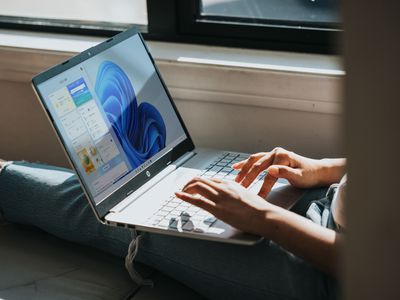 Woman using Windows 11 on laptop